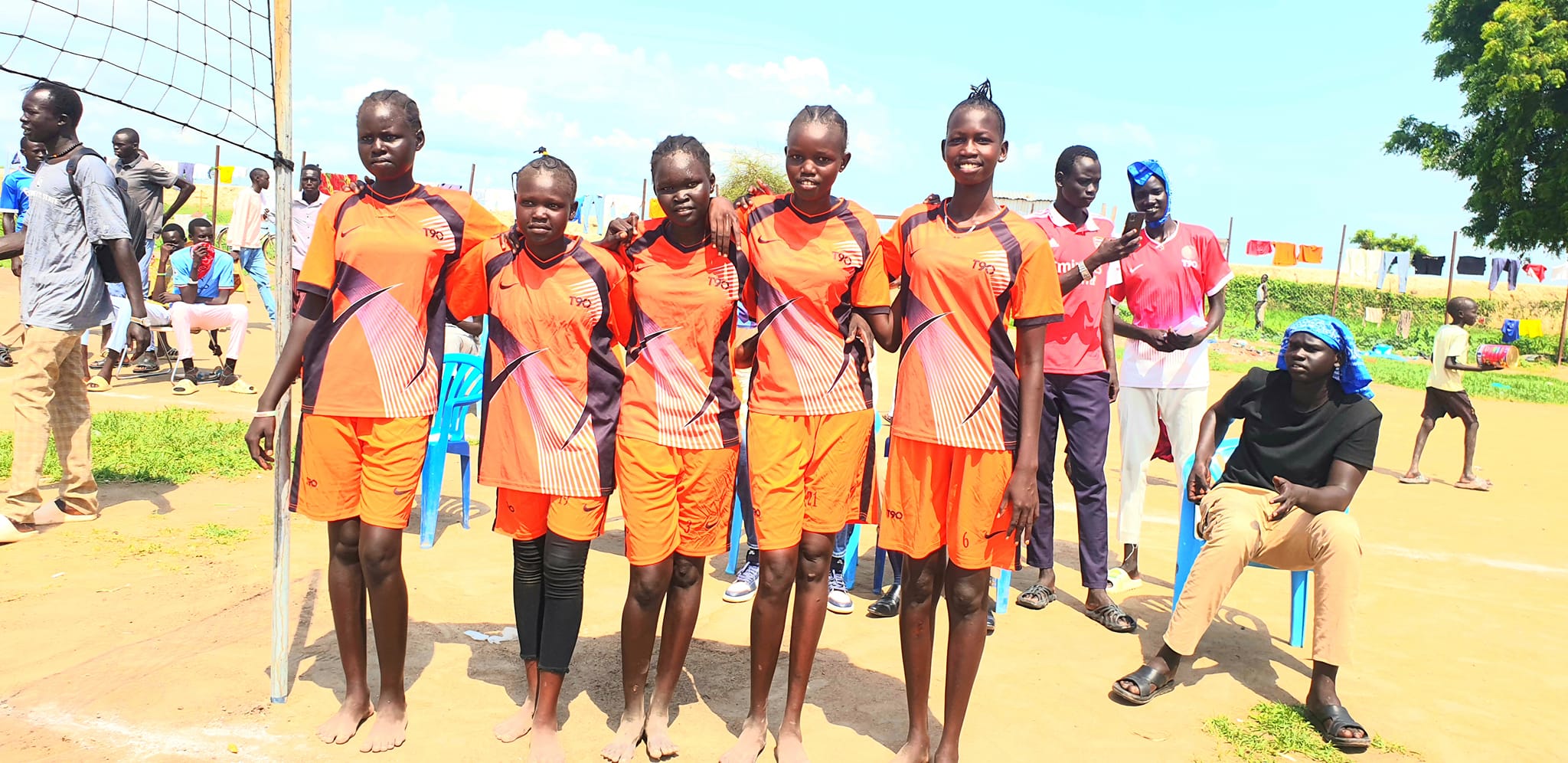 Saint Andrews girls sports team standing together