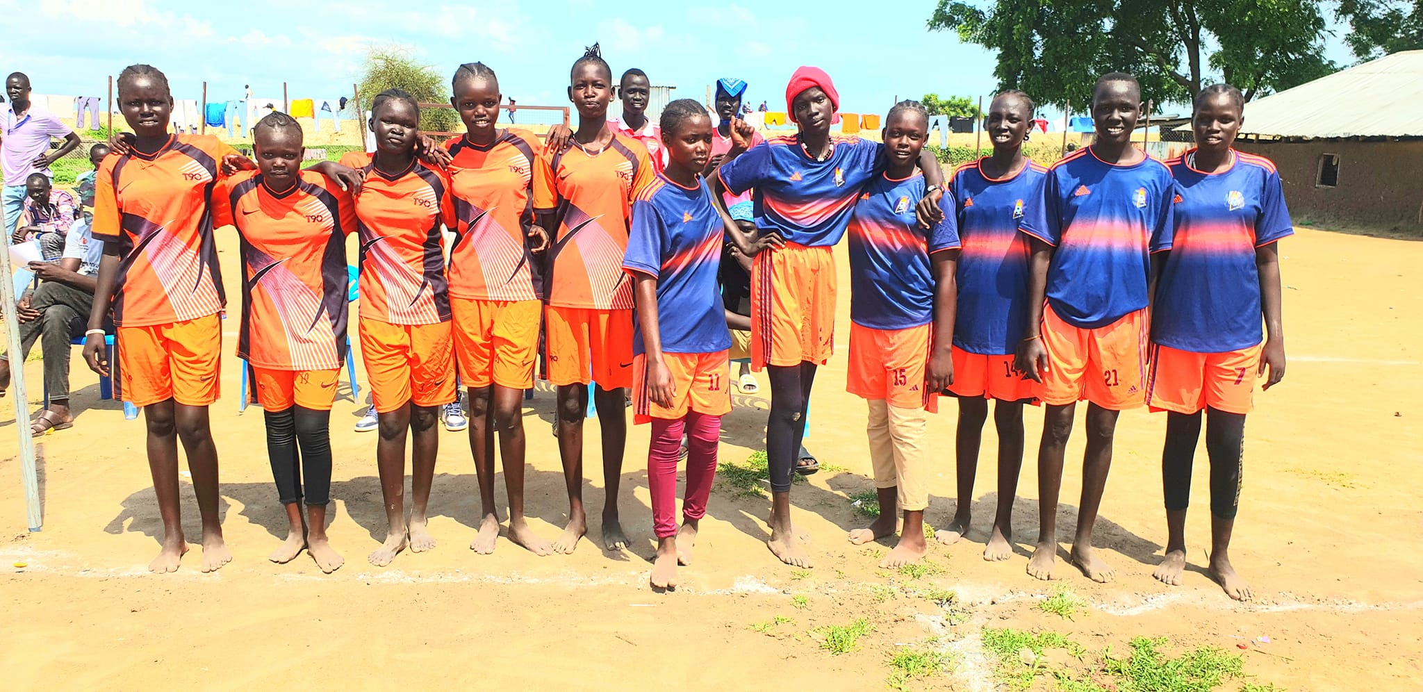 Girls team from Saint Andrews standing together on the sports ground